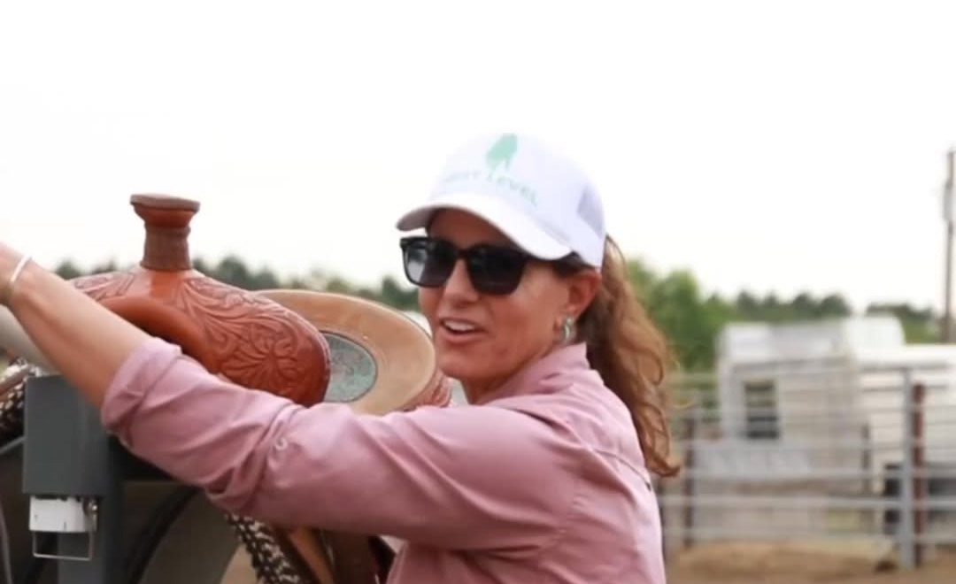 Stacey Martin with a saddle at the arena